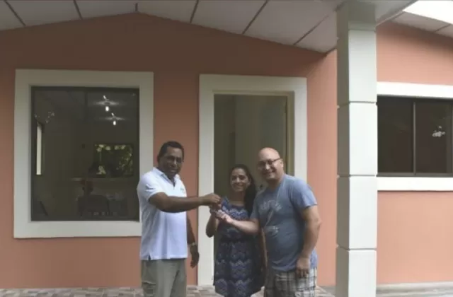 Juan Omar Quant Lee in front his family’s new home in Ticuantepe, Managua.