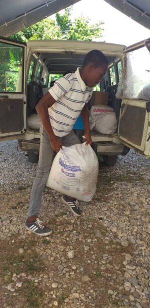 Seeds being offloaded in Camp Perrin