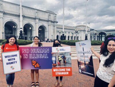Immigration advocates gather in front of Union Station in Washington D.C. to welcome migrants in a press conference.
