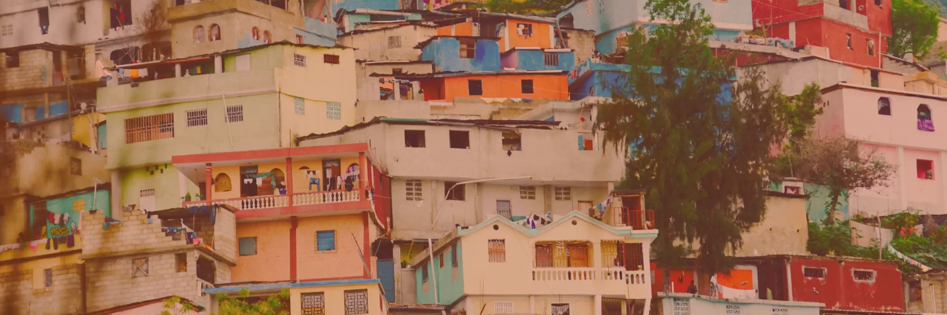 Brightly colored houses on a hillside.