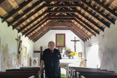 Father Roy Snipes inside La Lomita in October. Snipes has become a fierce defender of the chapel that gave Mission its name.