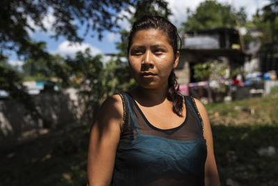 Honduran migrant Norma Leticia López, 21, poses for a photo on Oct. 26, 2018, in front of the migrant shelter Casa del Caminante Jtatic Samuel Ruiz García near Palenque, Chiapas. She left her country four days before she arrived to the shelter leaving behind two kids. Norma used to work at a bakery shop and says she did not make enough money to support her children; she says she could only afford rice and beans.